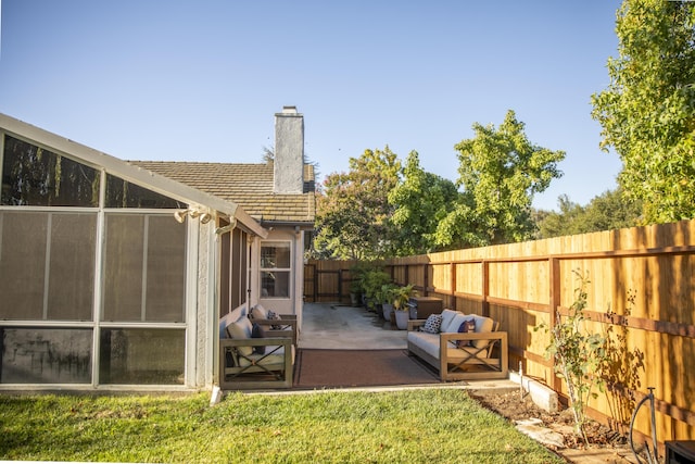 view of yard with a fenced backyard and a patio