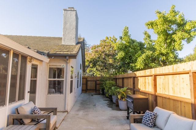 view of patio featuring fence