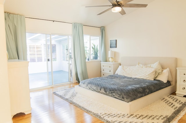 bedroom with lofted ceiling, access to outside, light wood finished floors, and a ceiling fan