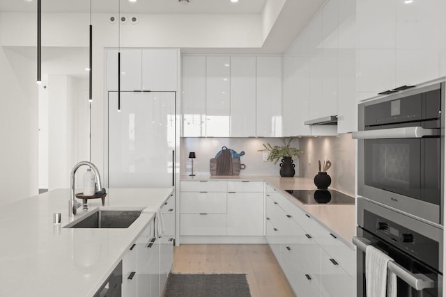 153 Nob Hill Ln, Ventura, CA 93003 - kitchen featuring black electric cooktop, modern cabinets, oven, and a sink
