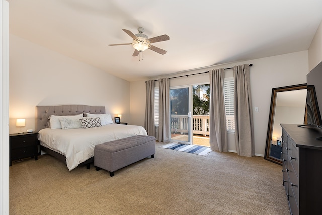 bedroom with a ceiling fan, access to outside, vaulted ceiling, and carpet