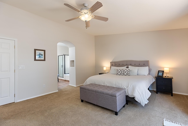 bedroom with a ceiling fan, arched walkways, light colored carpet, and baseboards