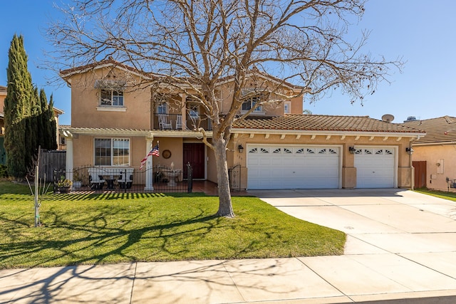 mediterranean / spanish house featuring a balcony, a garage, fence, driveway, and stucco siding