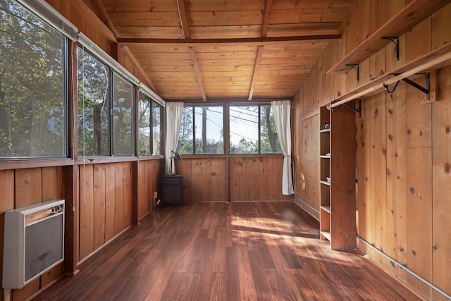 unfurnished sunroom featuring heating unit, wood ceiling, and lofted ceiling with beams