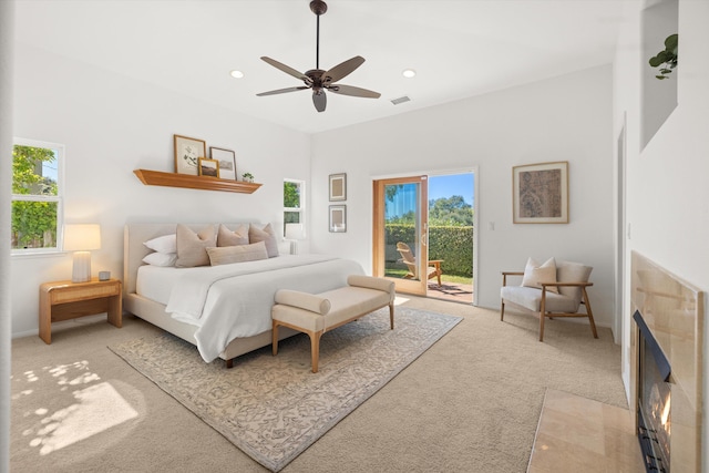 bedroom with recessed lighting, visible vents, light carpet, ceiling fan, and access to outside