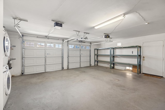 garage featuring a garage door opener and stacked washer and clothes dryer