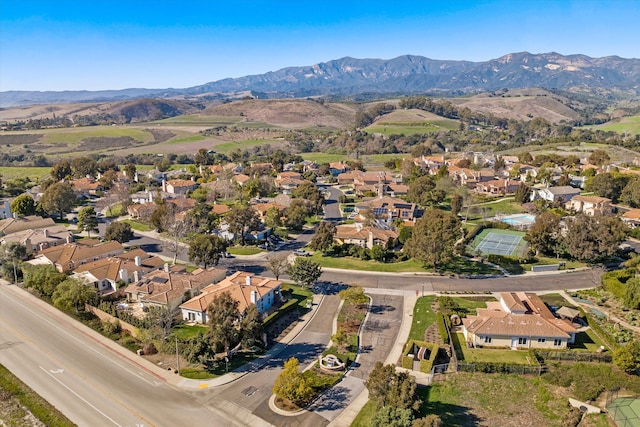 drone / aerial view with a residential view and a mountain view