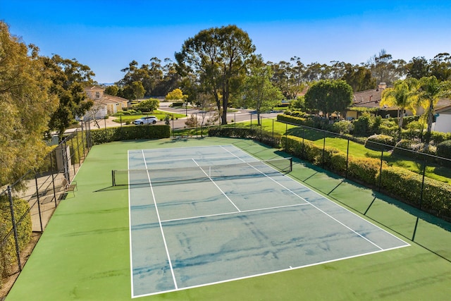 view of sport court with fence