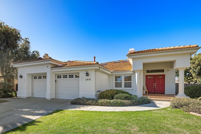 mediterranean / spanish-style house featuring a tiled roof, a chimney, and stucco siding