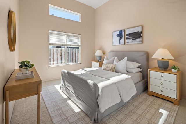 bedroom with light colored carpet