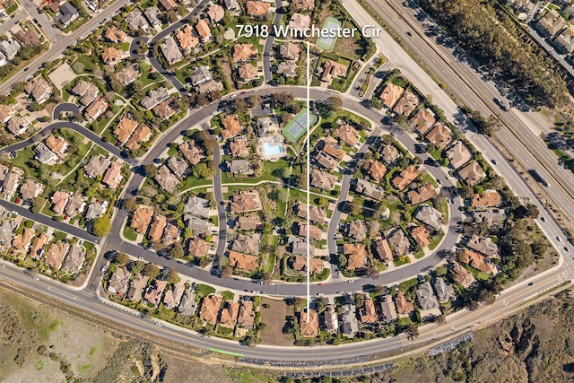 birds eye view of property with a residential view