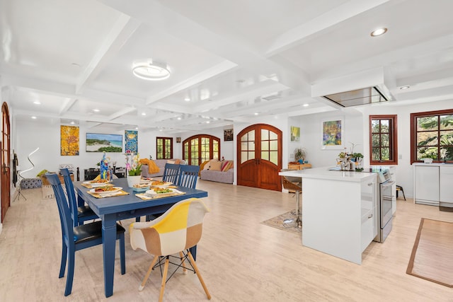 dining room with light wood finished floors, coffered ceiling, french doors, beam ceiling, and recessed lighting