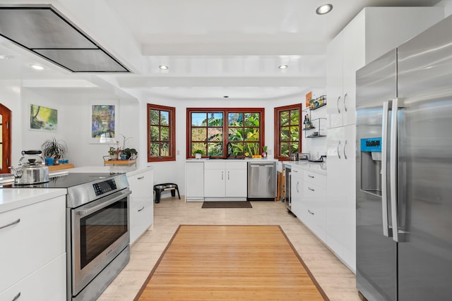 kitchen featuring light countertops, appliances with stainless steel finishes, modern cabinets, and white cabinets