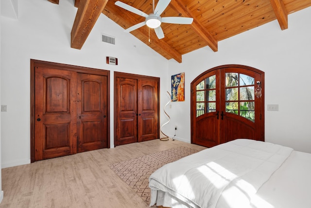 bedroom with visible vents, wood ceiling, wood finished floors, french doors, and beam ceiling