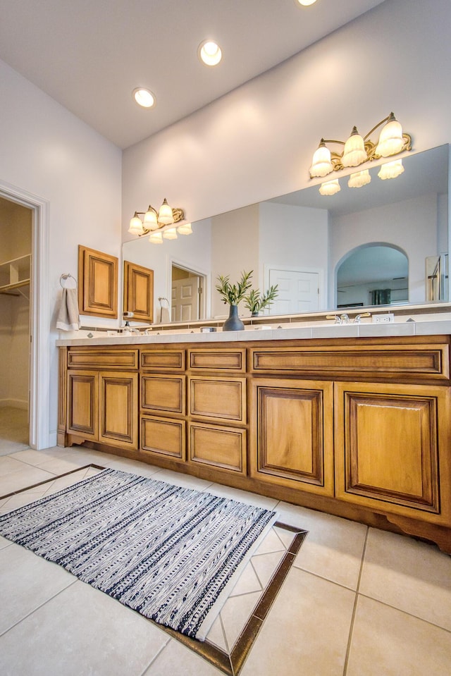 full bathroom with tile patterned flooring, recessed lighting, and double vanity