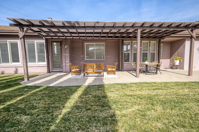 back of property with a patio area, a pergola, a lawn, and stucco siding