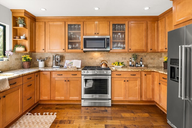 kitchen featuring open shelves, appliances with stainless steel finishes, decorative backsplash, and dark wood finished floors