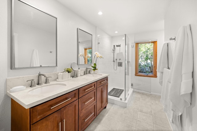 full bath with double vanity, recessed lighting, tile patterned floors, a sink, and a stall shower