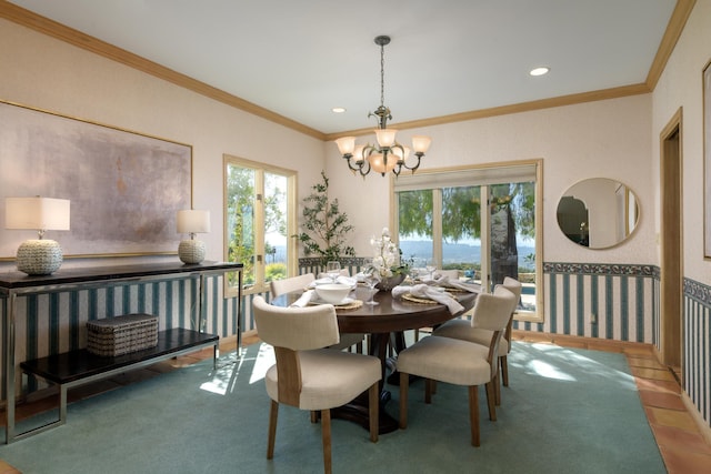 dining area featuring a healthy amount of sunlight, crown molding, a notable chandelier, and recessed lighting