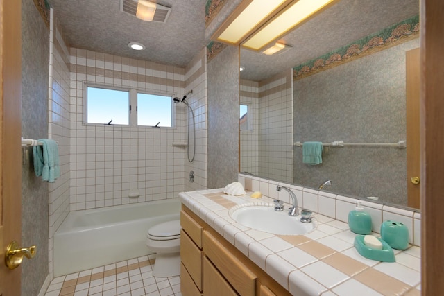 full bath with visible vents, toilet, a textured ceiling, vanity, and tile patterned flooring