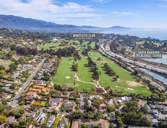 bird's eye view featuring golf course view and a water and mountain view