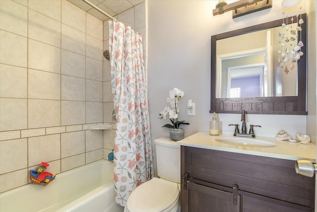 full bathroom featuring toilet, shower / tub combo with curtain, and vanity