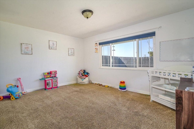 rec room featuring baseboards and carpet flooring