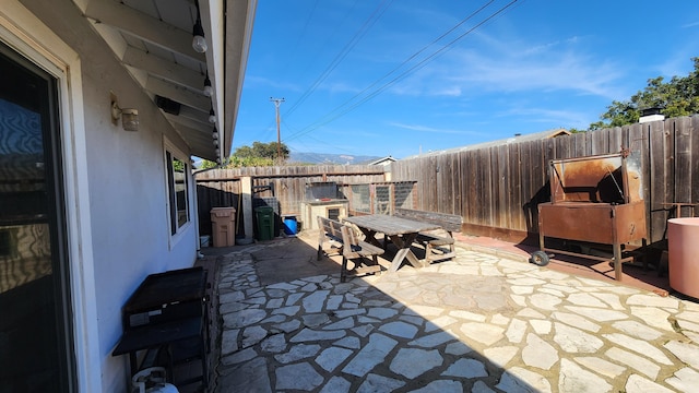 view of patio featuring outdoor dining space and a fenced backyard