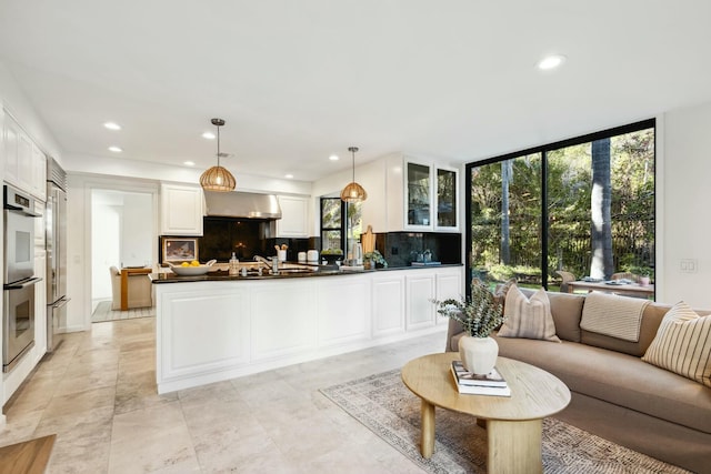 living room featuring recessed lighting and expansive windows