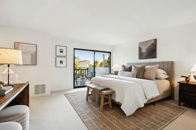 bedroom featuring visible vents, baseboards, carpet, and access to exterior