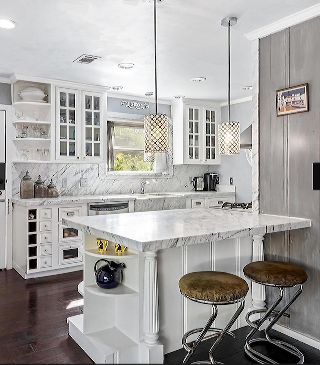 kitchen featuring visible vents, open shelves, and white cabinetry