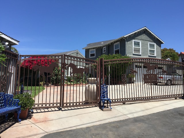 view of gate with fence