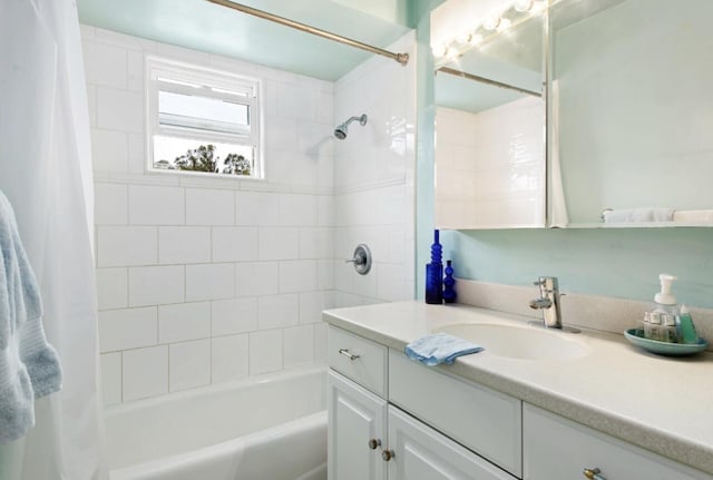 bathroom with shower / bath combination with curtain and vanity