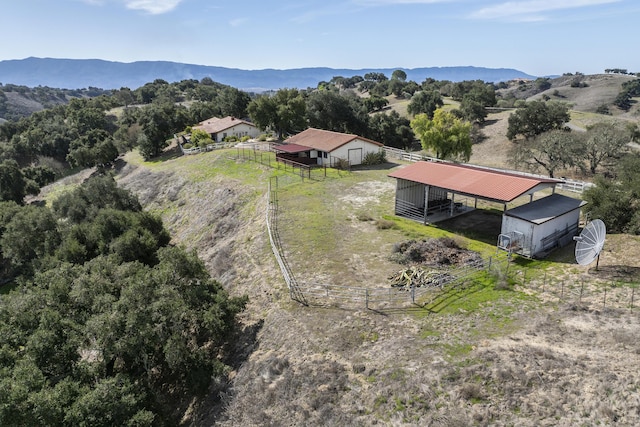 drone / aerial view featuring a rural view and a mountain view