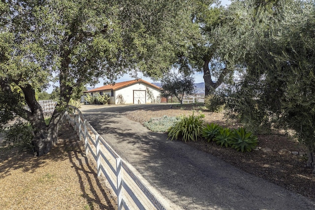 view of road with driveway