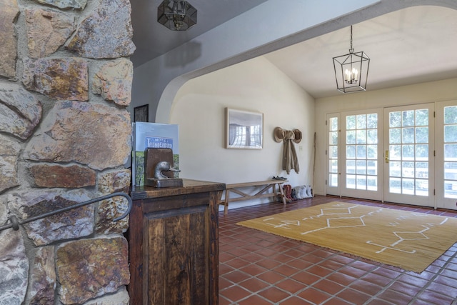 3776 Live Oak Rd, Santa Ynez, CA 93460 - foyer entrance with dark tile patterned floors, vaulted ceiling, and a notable chandelier