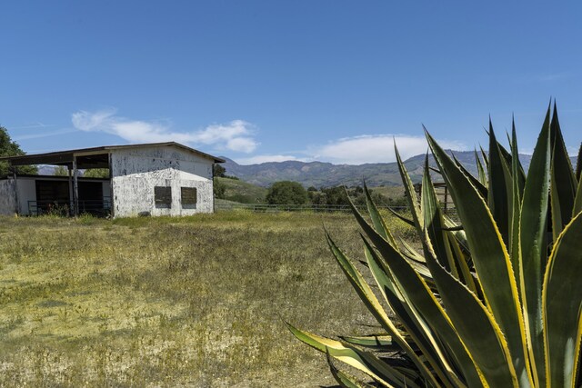 3776 Live Oak Rd, Santa Ynez, CA 93460 - view of yard with an outdoor structure, a mountain view, and fence
