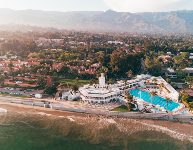 bird's eye view with a water and mountain view