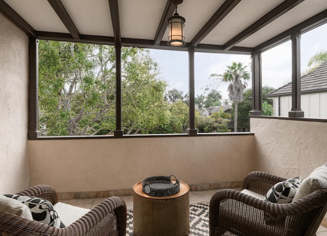 sunroom / solarium with beamed ceiling