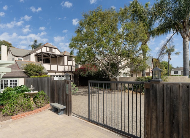 view of gate featuring a fenced front yard