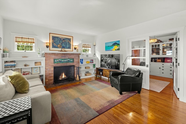 living area featuring a fireplace and wood finished floors