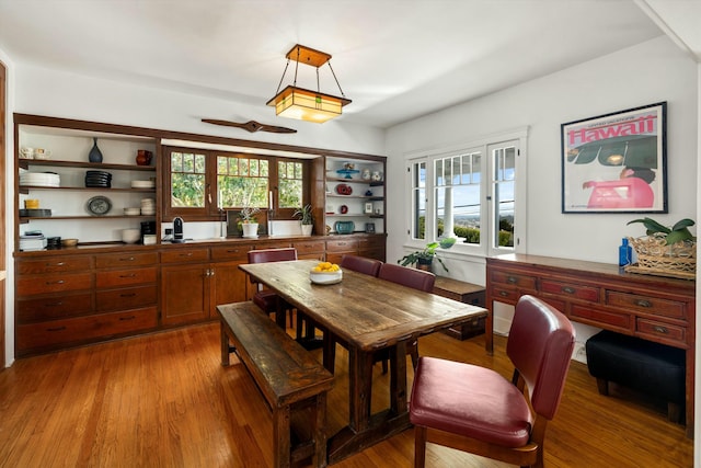 dining area with plenty of natural light and wood finished floors