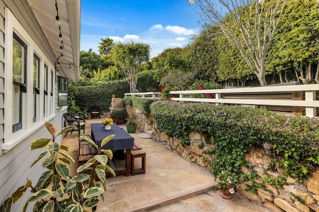 view of patio / terrace with outdoor dining area and fence