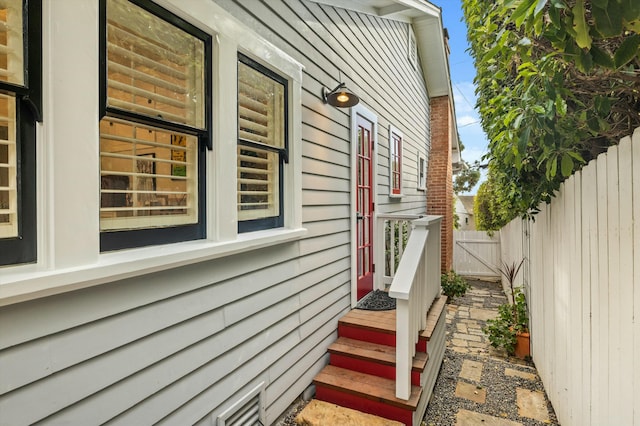 view of side of home with fence