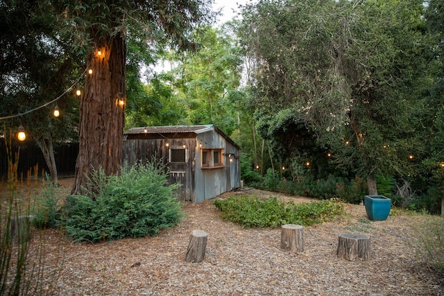 view of yard featuring an outbuilding and a storage unit