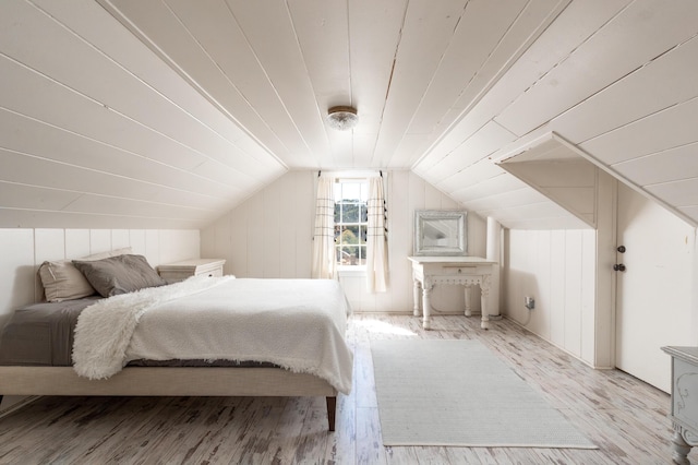 bedroom featuring vaulted ceiling and wood finished floors