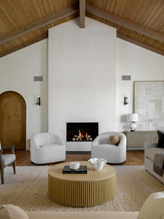living area featuring visible vents, wood finished floors, high vaulted ceiling, and wood ceiling