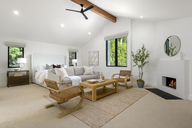 bedroom with recessed lighting, multiple windows, beam ceiling, and light carpet
