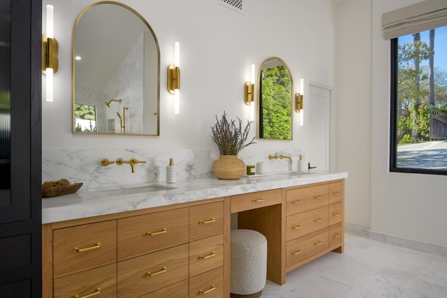 bathroom with visible vents, baseboards, walk in shower, vanity, and marble finish floor