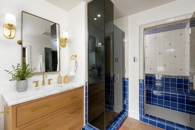 full bath featuring visible vents, vanity, tile patterned flooring, and a stall shower